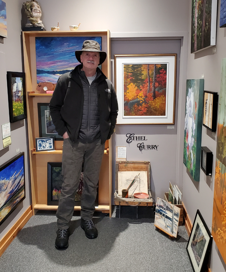 Person standing in front of art at Ethel Curry Art Gallery